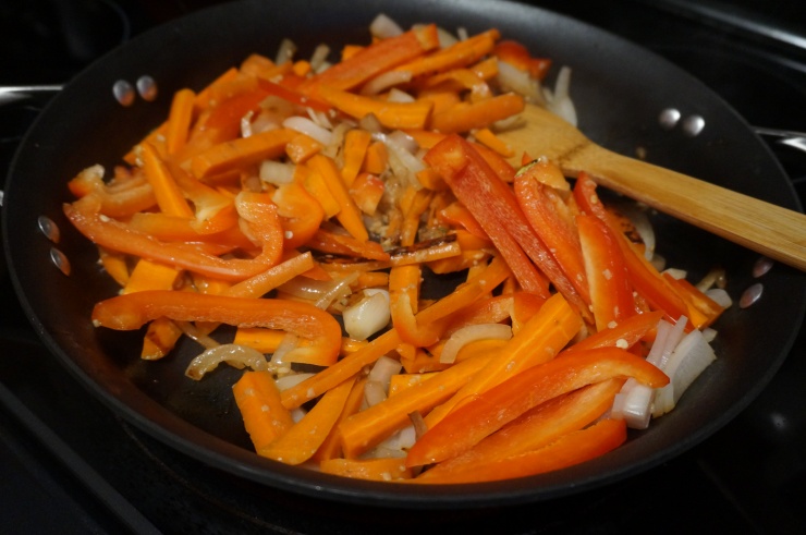 Cook up the carrots, onions, pepper and garlic.